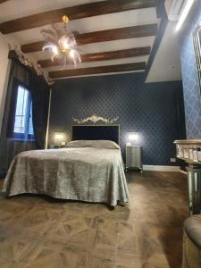 En eller flere senge i et værelse på Daniela's Venetian Style