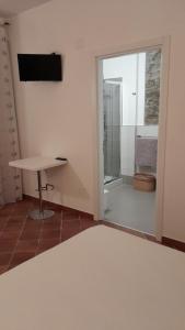 TV a/nebo společenská místnost v ubytování B&B Quattro Lune