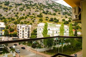 a view from a window of a city with a mountain at Flamingo Residence in Antalya