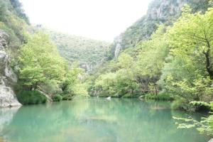a river in the middle of a canyon at ZenTerra Country house with prive swimming pool and view in Matésion