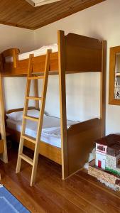 two bunk beds in a room with a ladder at Ana Rest House Hostel Berat in Berat