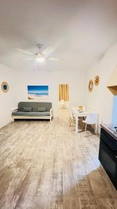 a living room with a couch and a table at Apartamentos Verdera Es Pujols in Es Pujols