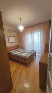 a bedroom with a bed in a room at Апартаменти поруч з метро Лівобережна in Kyiv