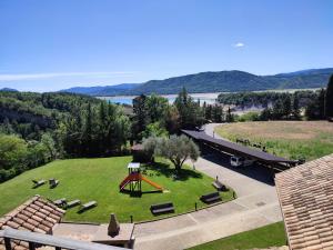 an aerial view of a park with a playground at Casas Pirineo, Ainsa in Aínsa +68 photos