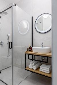 a bathroom with a sink and a mirror at Luxury Apartments Klara in Split