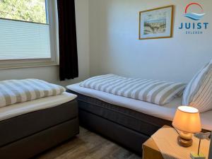Postel nebo postele na pokoji v ubytování Haus Nina 153 - Ferienwohnung 3