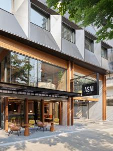 an asian building with chairs in front of it at ASAI Bangkok Sathorn in Bangkok