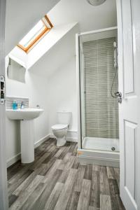 a bathroom with a toilet and a sink and a shower at George Stephenson 1 mile from North Tees Hospital in Stockton-on-Tees