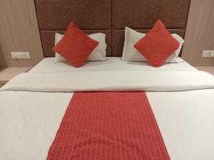 Voodi või voodid majutusasutuse Hotel Rajshree toas