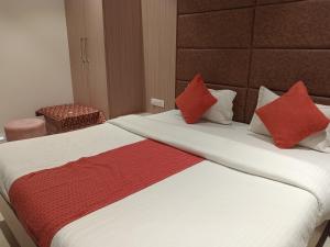 Voodi või voodid majutusasutuse Hotel Rajshree toas