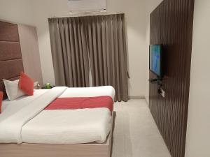 Voodi või voodid majutusasutuse Hotel Rajshree toas
