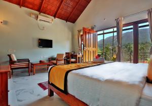Postel nebo postele na pokoji v ubytování Hill Crest Resort - Coorg