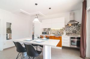 a kitchen with a table and chairs in a room at Beachside Villa Marko in Milna