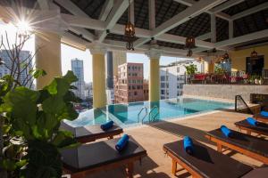 a swimming pool on the roof of a building at Khmer Surin Boutique Guesthouse in Phnom Penh
