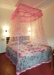 Letto o letti in una camera di Maneesha Guest House