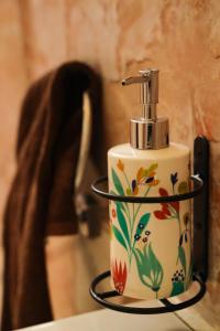 a soap dispenser sitting on top of a table at Copperhill- A Luxury Homestay in Madikeri