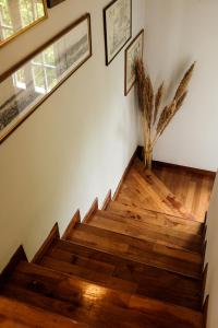 a staircase in a house with wooden floors at Coro Cozy House in Potamós