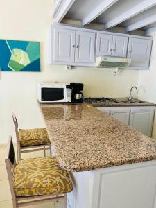 A kitchen or kitchenette at Beach house wing in kerkennah island. Fully equipped place for 4 guests and peaceful relaxing stay. Calm sea and beautiful sun rise that can be enjoyed straight on the beach or from the house terrace.