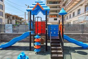 a playground with a slide at Studio Melody Nord 10 in Năvodari +29 photos