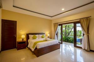 Ein Bett oder Betten in einem Zimmer der Unterkunft Villa Katara