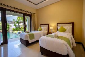Ein Bett oder Betten in einem Zimmer der Unterkunft Villa Katara
