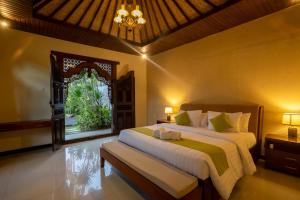 Ein Bett oder Betten in einem Zimmer der Unterkunft Villa Katara