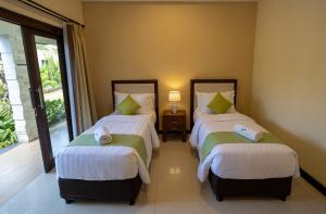 Ein Bett oder Betten in einem Zimmer der Unterkunft Villa Katara