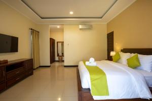 Ein Bett oder Betten in einem Zimmer der Unterkunft Villa Katara