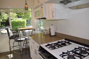 a kitchen with a stove and a counter top at Palo Alto 1 Bedroom Near Stanford University in Palo Alto