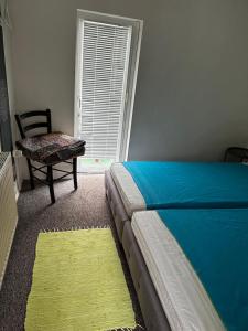 Un pat sau paturi într-o cameră la Gästehaus