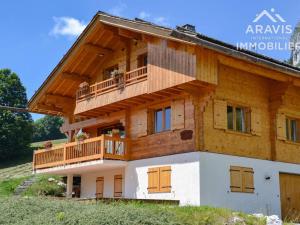 a house with a balcony on the side of it at Chalet Le Grand-Bornand, 7 pièces, 12 personnes - FR-1-391-30 in Le Grand-Bornand