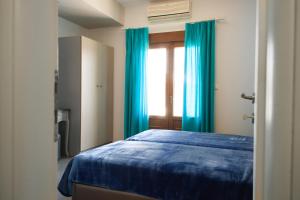 Cama o camas de una habitación en Emmeleia Accommodation by Maria Riga