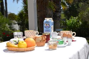a table with eggs and baskets of food on it at MAISON LES AGAPANTHES in Villeneuve-lès-Béziers