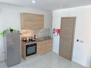 Kuchyň nebo kuchyňský kout v ubytování For Rest Aparthotel