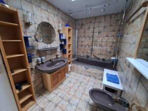 a large bathroom with a sink and a shower at WenneGlück in Meschede