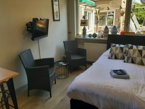 Reštaurácia alebo iné gastronomické zariadenie v ubytovaní Tuinhuis Duinroos Deluxe