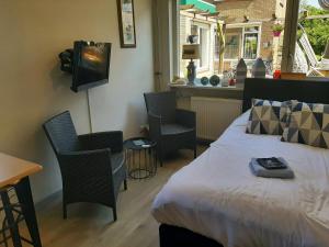 Μια τηλεόραση ή/και κέντρο ψυχαγωγίας στο Tuinhuis Duinroos Deluxe