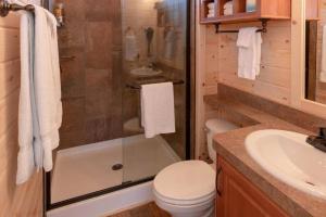 a bathroom with a shower and a toilet and a sink at 080 Tiny Home nr Grand Canyon South Rim Sleeps 8 in Valle