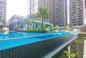 a swimming pool in a city with tall buildings at rumaKL at Majestic Maxim in Kuala Lumpur