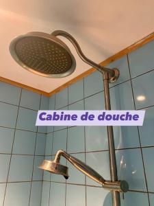 a light on the ceiling of a bathroom with a sign at Gîte Chambre de la Tante Camille - Les Filles Tresy in Passenans +26 photos