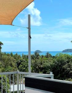 a view of the ocean from the balcony of a house at Valley View in Ko Chang