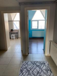 a hallway with two windows and a tiled floor at Beylikdüzü bölgesinde tarz daire in Beylikduzu