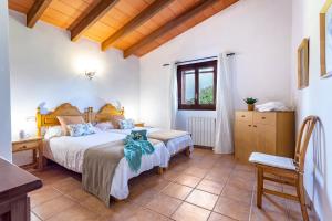 A bed or beds in a room at Son Garrot by dracmallorca Még 26 kép