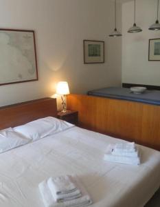 Giường trong phòng chung tại Punta Ala Boboli Apartment