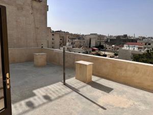 a view of a city from the roof of a building at 2 Bedrooms flat with balconies! in Amman