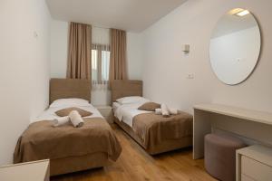 Postel nebo postele na pokoji v ubytování Apartments Lea