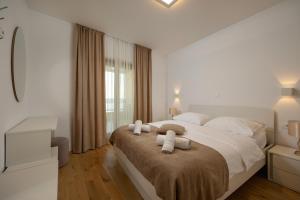 Postel nebo postele na pokoji v ubytování Apartments Lea