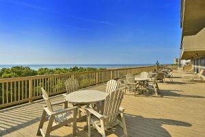 a row of tables and chairs on a deck at Century I 1622 in Ocean City