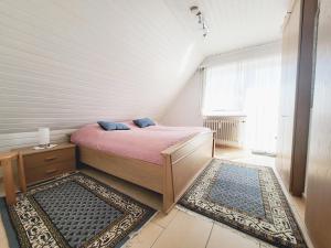 Postel nebo postele na pokoji v ubytování Friesenhain Ferienwohnungen