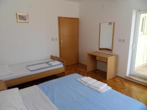 Posteľ alebo postele v izbe v ubytovaní Apartments Petricevic